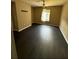 Bedroom with dark wood floors, natural lighting, and tan colored walls at 8517 Island Breeze Ln # 207, Temple Terrace, FL 33637