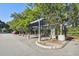 Parking area with covered parking for residents at 8517 Island Breeze Ln # 207, Temple Terrace, FL 33637