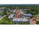Aerial view featuring the community with a lake and common areas at 952 Virginia St # 303, Dunedin, FL 34698