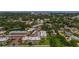 Aerial view of condo community with lakes, mature trees, and well-maintained landscaping at 952 Virginia St # 303, Dunedin, FL 34698