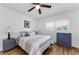 Bright bedroom featuring wood floors, ceiling fan, and natural light from the window at 952 Virginia St # 303, Dunedin, FL 34698