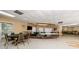 Spacious game room with poker table, lounge area, and ample seating at 952 Virginia St # 303, Dunedin, FL 34698