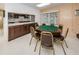 Game room featuring a poker table, wet bar, and comfortable seating at 952 Virginia St # 303, Dunedin, FL 34698