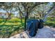 Community grilling area with covered grills, and picnic table at 952 Virginia St # 303, Dunedin, FL 34698