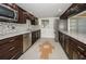 Charming kitchen features stainless appliances, granite countertops, and mosaic backsplash at 952 Virginia St # 303, Dunedin, FL 34698