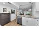 Open kitchen featuring stainless steel appliances, white cabinets, and an eat-in counter at 952 Virginia St # 303, Dunedin, FL 34698