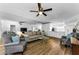 Bright living room featuring hardwood floors and stylish, neutral decor at 952 Virginia St # 303, Dunedin, FL 34698