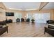 Relaxing lounge area with comfortable seating, a large TV, and natural light at 952 Virginia St # 303, Dunedin, FL 34698