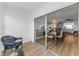 Bright sunroom with sliding glass doors offering views into the dining and living areas at 952 Virginia St # 303, Dunedin, FL 34698