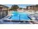Large community pool with sundeck and lounging chairs, ideal for relaxation at 952 Virginia St # 303, Dunedin, FL 34698