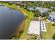 Aerial view of the lakefront beach, community pool, and clubhouse at 11038 Spring Point Cir, Riverview, FL 33579
