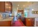 Open kitchen with granite countertops, stainless steel appliances, and center island with wood floors at 11038 Spring Point Cir, Riverview, FL 33579