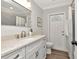 Bathroom featuring a granite countertop, sleek faucet, and tile backsplash at 111 Carlyle Dr, Palm Harbor, FL 34683