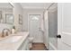 Bathroom showcasing the vanity, faucet, mirror, toilet, and tub/shower combo at 111 Carlyle Dr, Palm Harbor, FL 34683