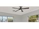 Bedroom featuring windows with blinds, a ceiling fan, and neutral wall color at 111 Carlyle Dr, Palm Harbor, FL 34683