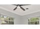 Bedroom featuring windows with blinds, a ceiling fan, and neutral wall color at 111 Carlyle Dr, Palm Harbor, FL 34683