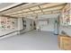Spacious garage with ample room for parking, storage, and a utility sink at 111 Carlyle Dr, Palm Harbor, FL 34683