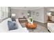 Bright living room with modern decor, hardwood floors, and an open layout at 111 Carlyle Dr, Palm Harbor, FL 34683