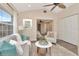 Cozy living room featuring a plush sofa, stylish decor, and view to bedroom at 111 Carlyle Dr, Palm Harbor, FL 34683