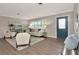 Bright living room with hardwood floors, stylish furniture, and a modern decor at 111 Carlyle Dr, Palm Harbor, FL 34683