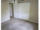 Cozy bedroom with a ceiling fan, carpeting, neutral paint, and closet with folding doors at 12615 Logan Pl, Tampa, FL 33625