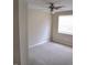 Comfortable bedroom featuring neutral paint, a window with blinds, and a ceiling fan for climate control at 12615 Logan Pl, Tampa, FL 33625