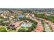 Aerial view shows the community, with the resort-style pool, clubhouse, and beautiful landscaping at 137 Silver Falls Dr, Apollo Beach, FL 33572