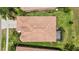 Birds eye view of the house, showing tile roof, backyard, lanai and landscaping at 137 Silver Falls Dr, Apollo Beach, FL 33572