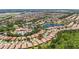 Aerial view showing house in relation to community amenities, lake and surrounding neighborhood at 137 Silver Falls Dr, Apollo Beach, FL 33572