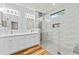Modern bathroom with a double vanity, updated shower, and stylish tile work at 137 Silver Falls Dr, Apollo Beach, FL 33572