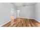 Light-filled bedroom with wood-look floors and views to hallway and closet at 137 Silver Falls Dr, Apollo Beach, FL 33572