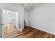 Spacious room with wood-look floors, neutral walls, open door with view into next room at 137 Silver Falls Dr, Apollo Beach, FL 33572
