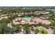 Aerial view of the community pool area, including a splash pad, gathering areas, and sun loungers at 137 Silver Falls Dr, Apollo Beach, FL 33572