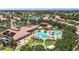 Community clubhouse and pool with multiple pools, shade structures, and manicured landscaping at 137 Silver Falls Dr, Apollo Beach, FL 33572