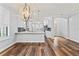Spacious kitchen with a large island, stainless steel appliances, and hardwood floors at 137 Silver Falls Dr, Apollo Beach, FL 33572