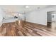 Bright living room boasts hardwood floors, recessed lights, and open floor plan to the kitchen at 137 Silver Falls Dr, Apollo Beach, FL 33572