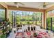 Enjoy outdoor living on the screened porch with tile floor and views of the green backyard at 137 Silver Falls Dr, Apollo Beach, FL 33572