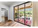 Sunroom with sliding glass doors provides view of lush greenery and screened outdoor living area at 137 Silver Falls Dr, Apollo Beach, FL 33572