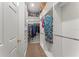 Organized walk-in closet with ample shelving and hanging space for clothes and accessories at 137 Silver Falls Dr, Apollo Beach, FL 33572