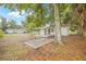 Backyard view showing the house, car port, and concrete patio at 1401 30Th N Ave, St Petersburg, FL 33704