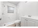 Bright bathroom with marble-look tiled shower, modern vanity, and stylish fixtures at 1401 30Th N Ave, St Petersburg, FL 33704