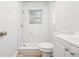 Bright bathroom with marble-look tiled shower, modern vanity, and sleek fixtures at 1401 30Th N Ave, St Petersburg, FL 33704