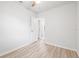 Bright bedroom features neutral walls, light wood floors, ceiling fan and ensuite bathroom access at 1401 30Th N Ave, St Petersburg, FL 33704