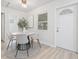 Cozy dining area offers a clean design with an adjacent view into the bathroom at 1401 30Th N Ave, St Petersburg, FL 33704