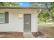 Front exterior showcasing the house number and covered entry at 1401 30Th N Ave, St Petersburg, FL 33704
