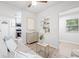 Inviting living room with a view to the kitchen, complemented by chic decor and ample natural light at 1401 30Th N Ave, St Petersburg, FL 33704