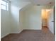 A cozy bedroom featuring carpet and window, with white trim and neutral walls at 1421 Dew Bloom Rd, Valrico, FL 33594