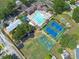 Overhead view of the community pool, tennis and basketball courts, with ample parking at 1421 Dew Bloom Rd, Valrico, FL 33594