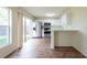 Modern kitchen featuring stainless steel appliances, white cabinets, and a breakfast bar at 1421 Dew Bloom Rd, Valrico, FL 33594
