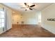 Open-concept living room with wood-look floors and views to other rooms at 1421 Dew Bloom Rd, Valrico, FL 33594